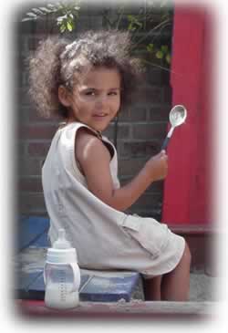 Manou at play in her sandbox